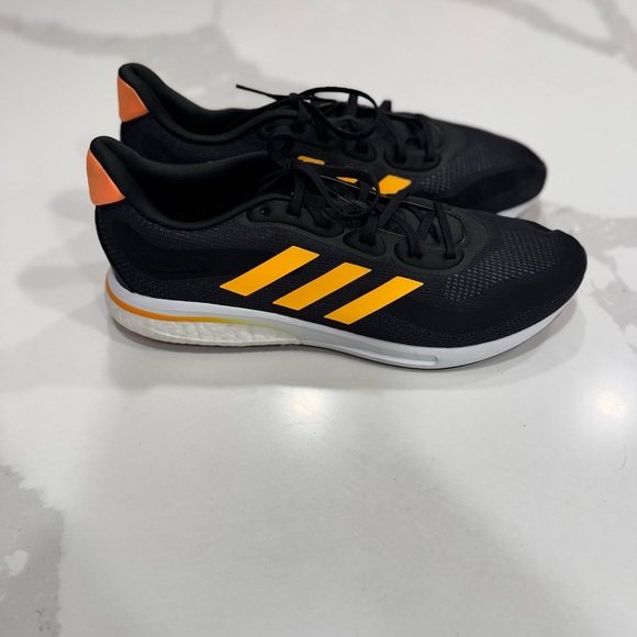adidas Other - Adidas Supernova M 'Black Flash Orange' running shoe with model number GX2964.